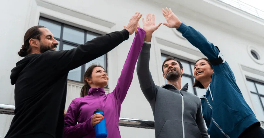 Employees high-fiving each other