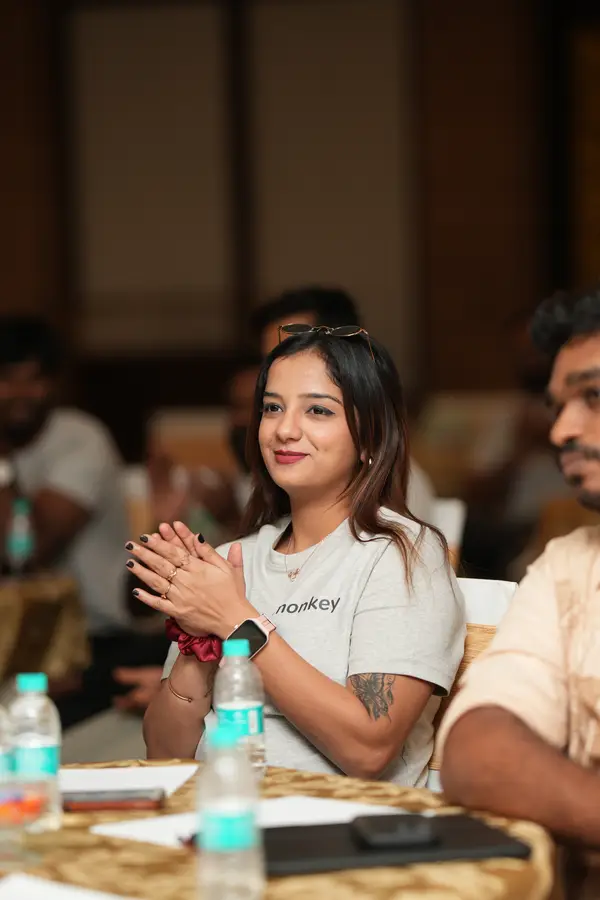 A team member applauding during an event