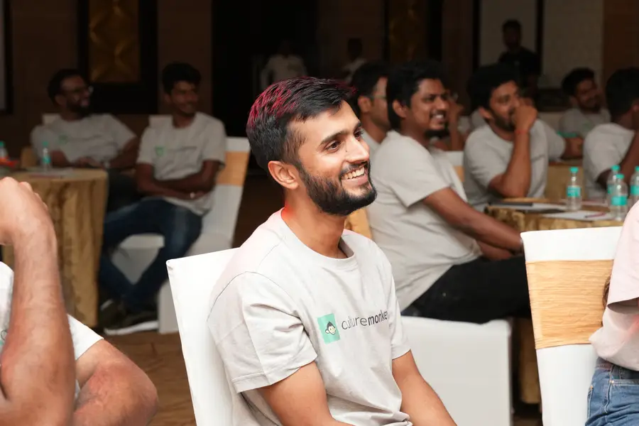 CultureMonkey team members laughing during a session